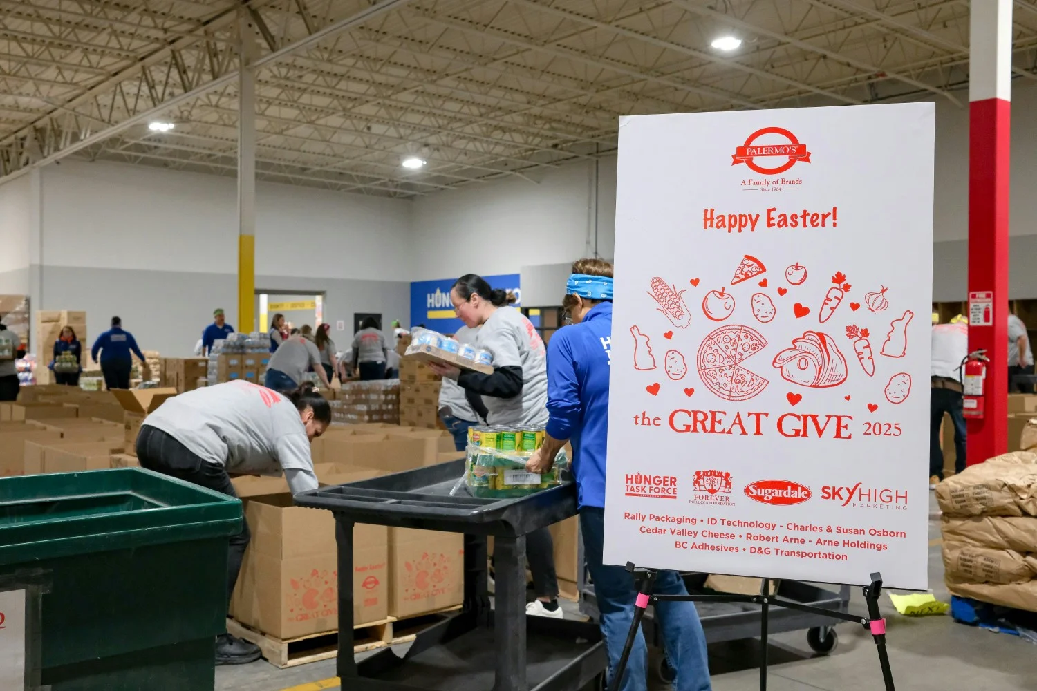 Employee's packing up food for a food drive.